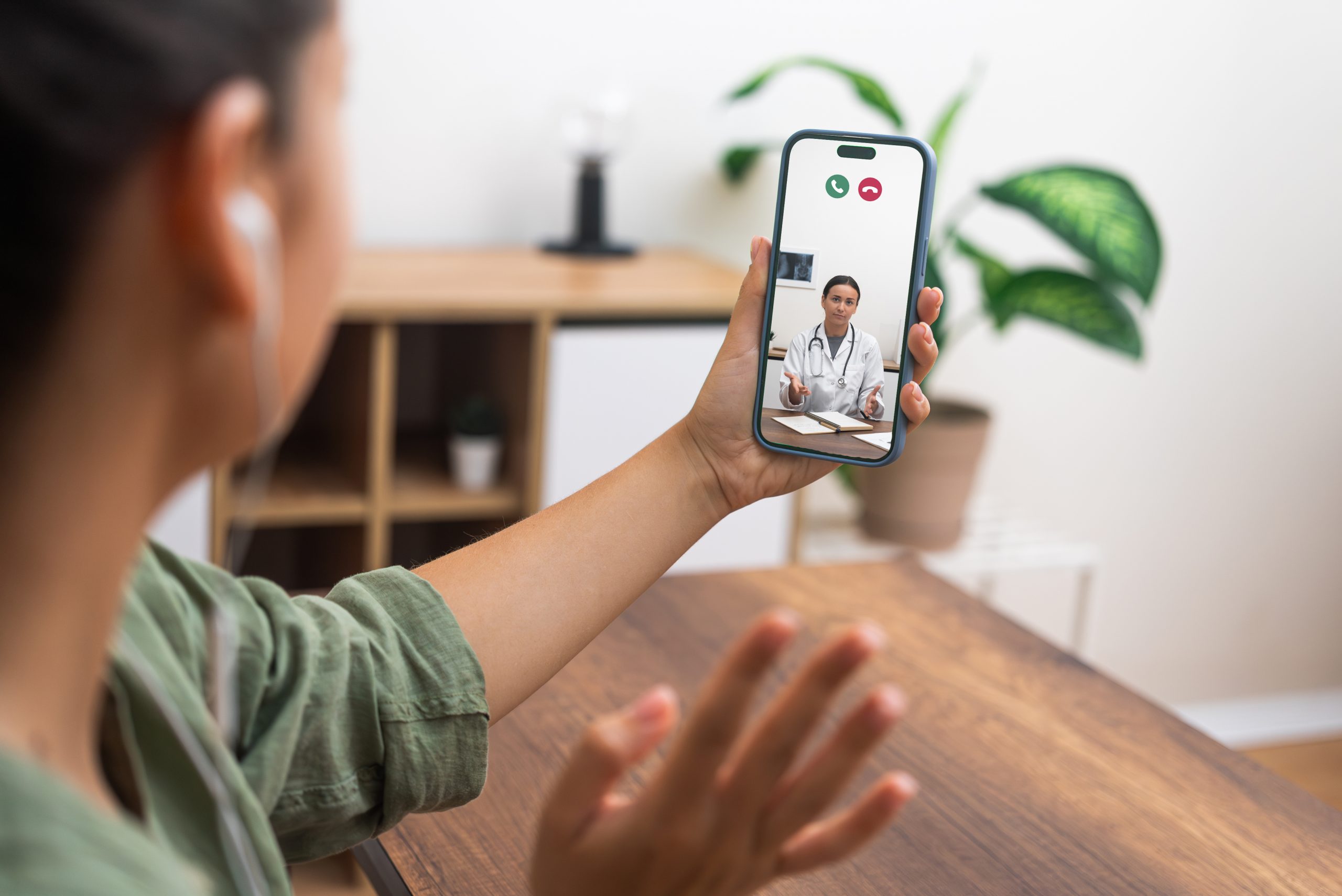 Woman talking to a doctor on her phone.